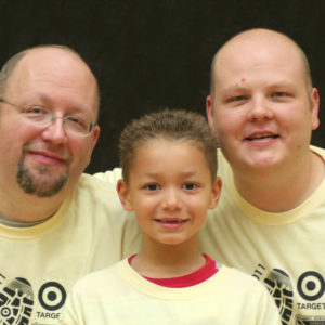 Two dads with young child