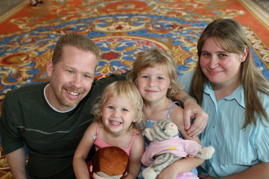 Two girls with their mom and dad.