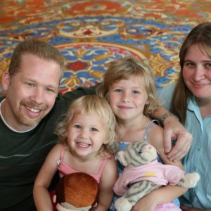 Two girls with their mom and dad.
