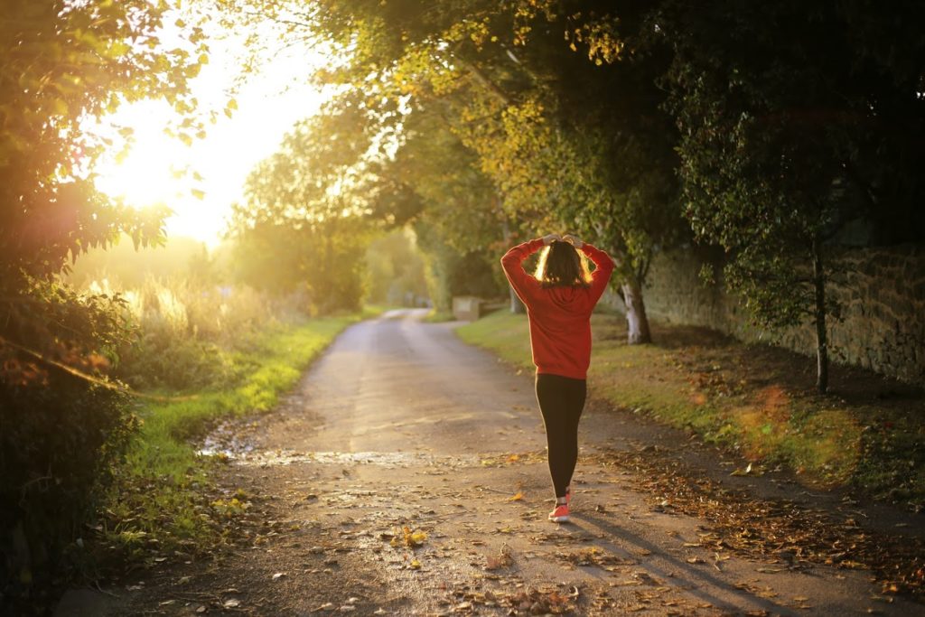 Woman walking down path