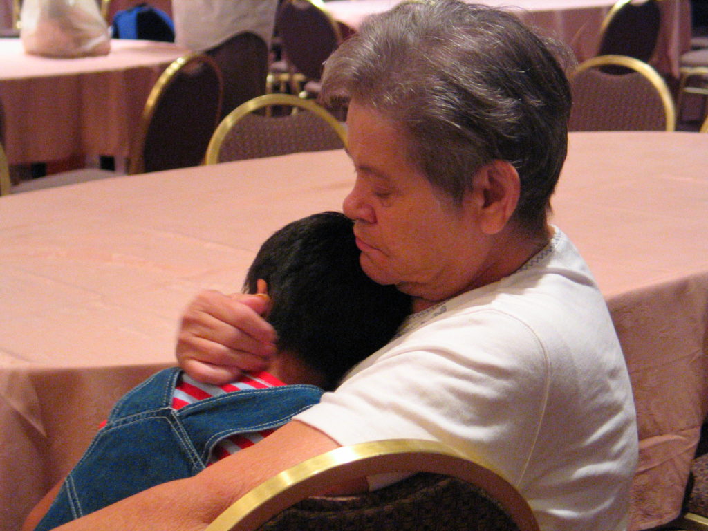 mother hugging child
