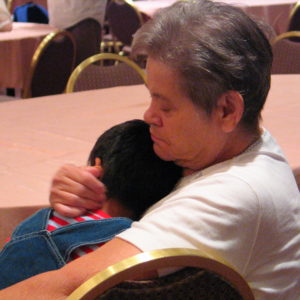 mother hugging child