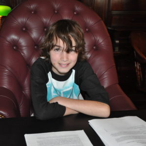 Boy in chair on adoption day
