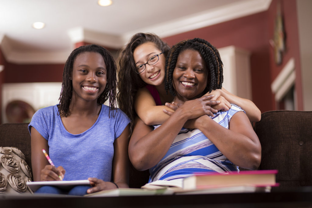 Mother and daughters doing homework